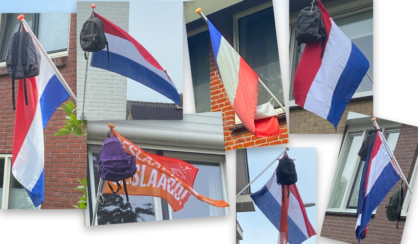 De vlaggen hangen uit voor de geslaagden